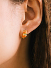 Load image into Gallery viewer, Lovers Tempo: Croissant Enamel Huggie Hoops Earrings in Gold/Orange
