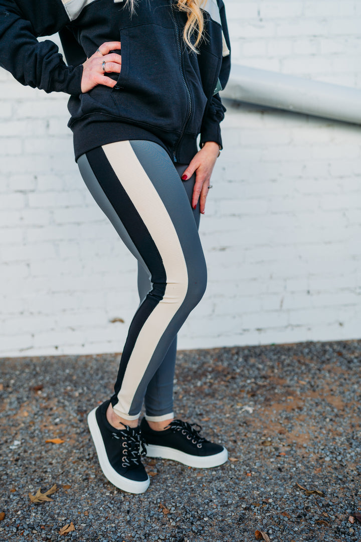 Glyder: Directional Legging in Carbon, Oatmilk, and Black