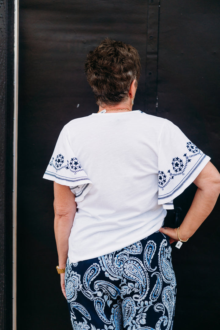 Karen Kane: Embroidered Flutter Sleeve Top in Off White