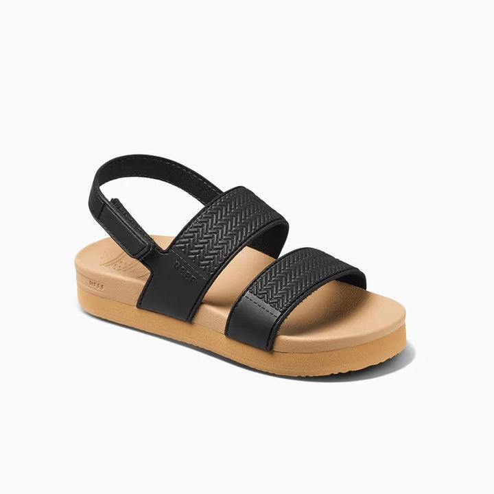 A black and tan Reef Water Vista sandal with Velcro straps and a rubber sponge outsole, designed for children.