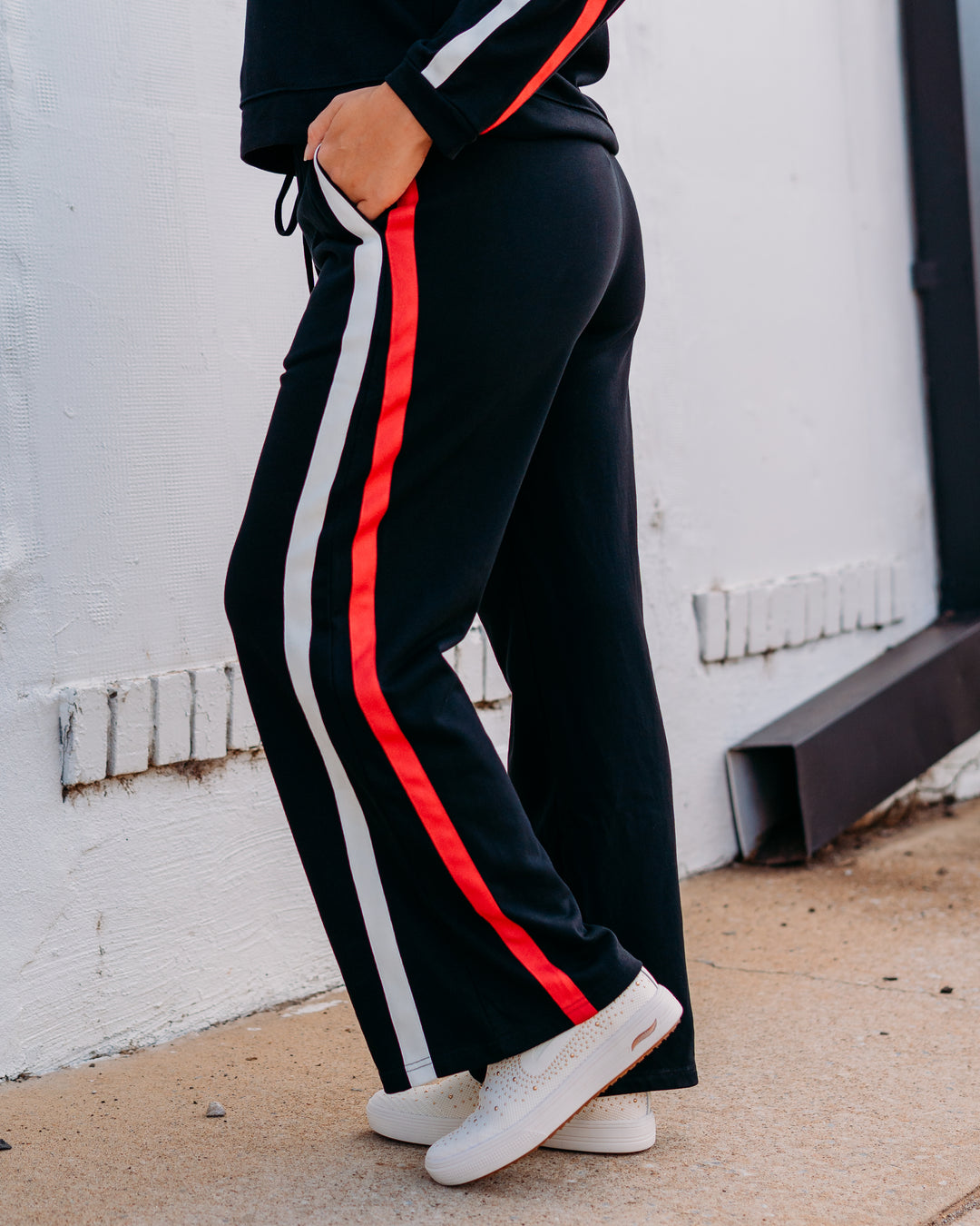 Jodifil: Track Pant in Black, Red, and Black