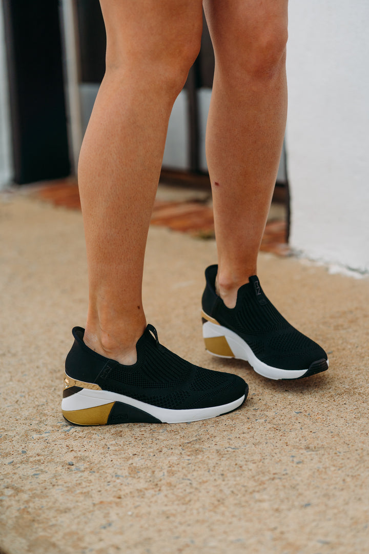 Skechers: A Wedge Crecent Sneaker in Black