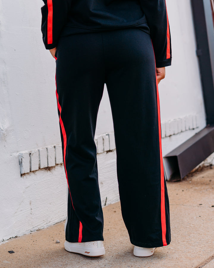 Jodifil: Track Pant in Black, Red, and Black