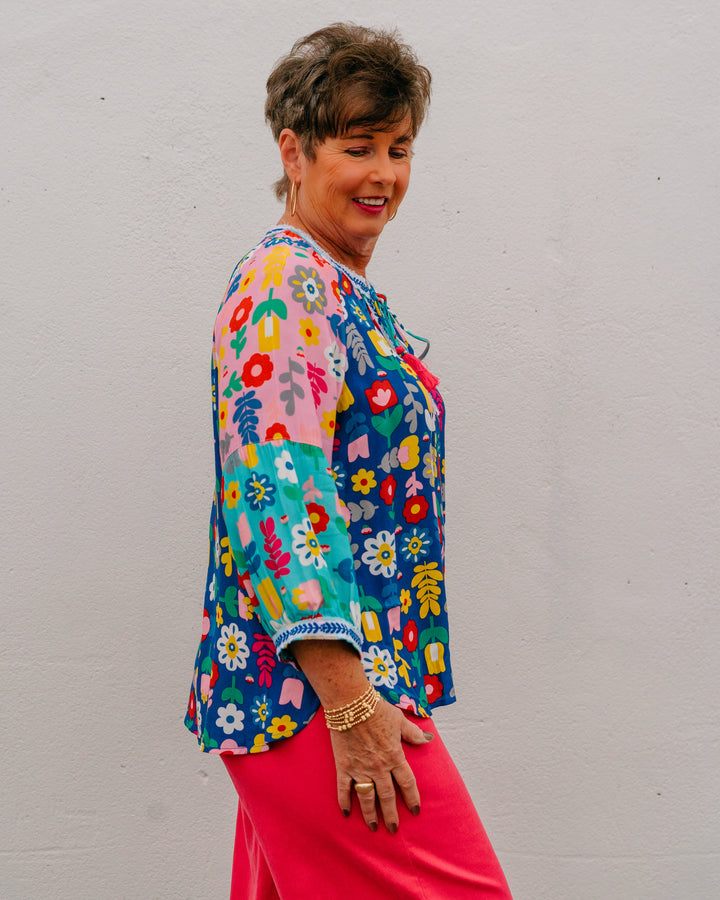 John Mark: Multi Floral Top with Frayed Trim, Tassel Ties & Blouson Sleeves (J26436TM) - The Vogue Boutique