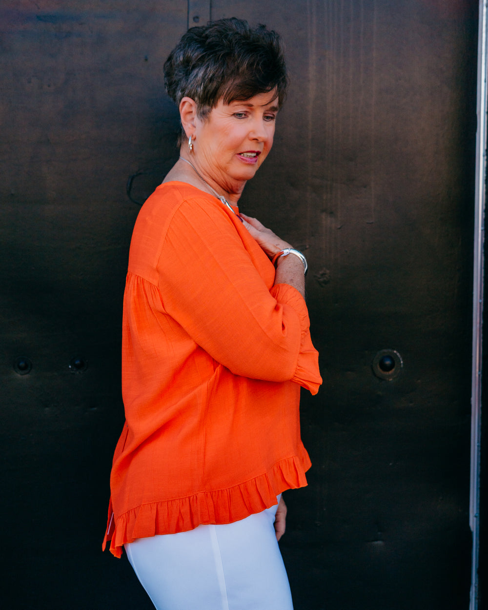 Multiples: Elbow Sleeve Scoop Neck Ruffle Hi-Lo Button Bk Top in International Orange (M26511TM) - The Vogue Boutique