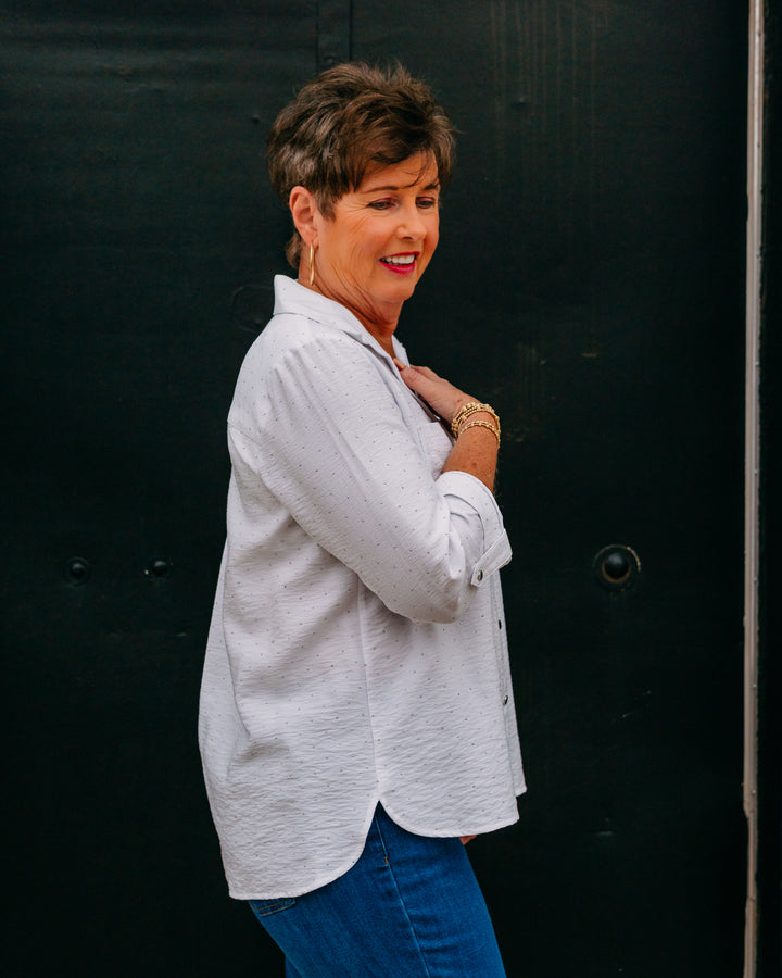 Multiples: Crunch Tab 3/4 Sleeve 2-Pocket Button Front High-Low Shirt in White - The Vogue Boutique