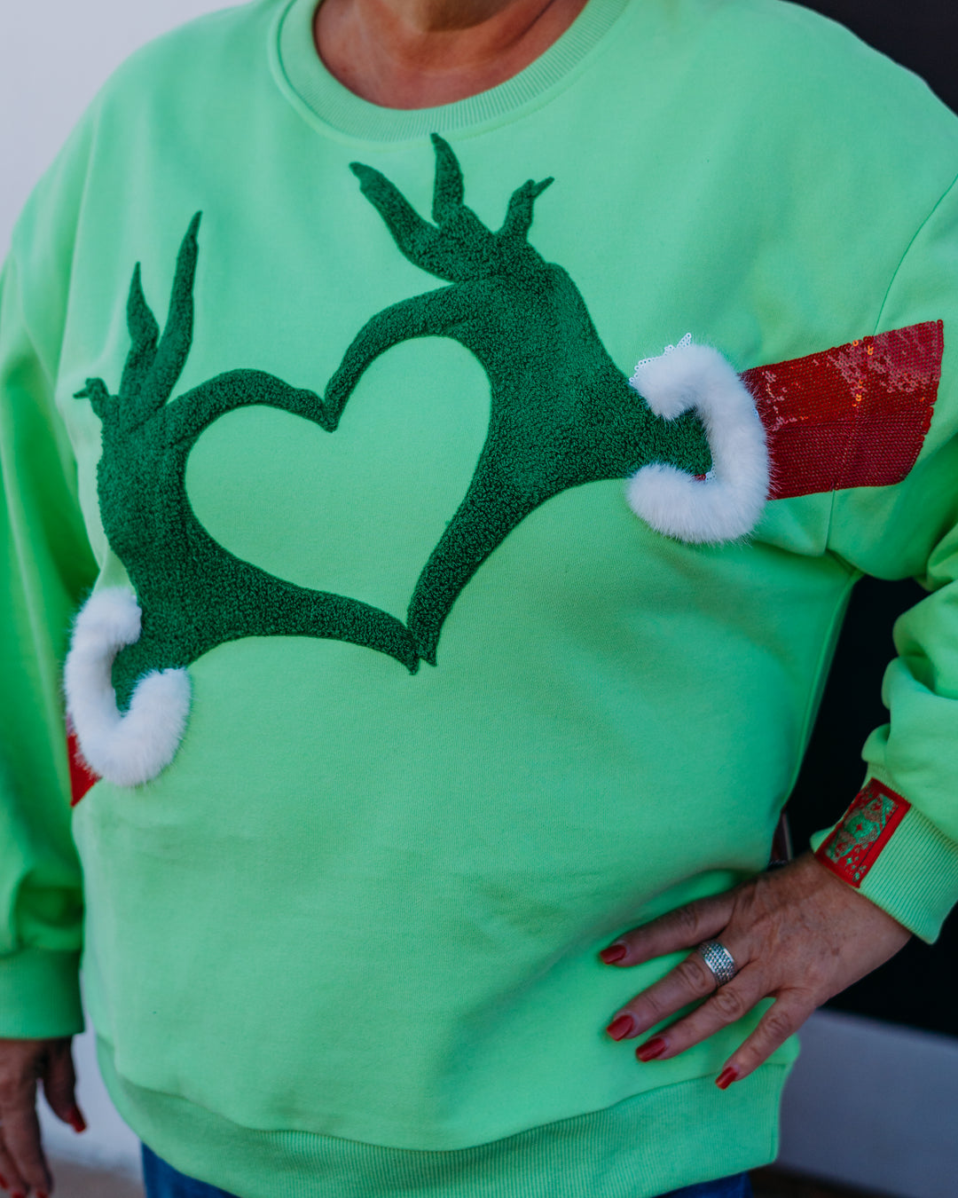 Queen Of Sparkles:Green Grinch Heart Hands Sweatshirt