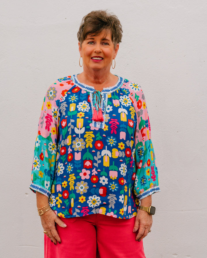 John Mark: Multi Floral Top with Frayed Trim, Tassel Ties & Blouson Sleeves (J26436TM) - The Vogue Boutique
