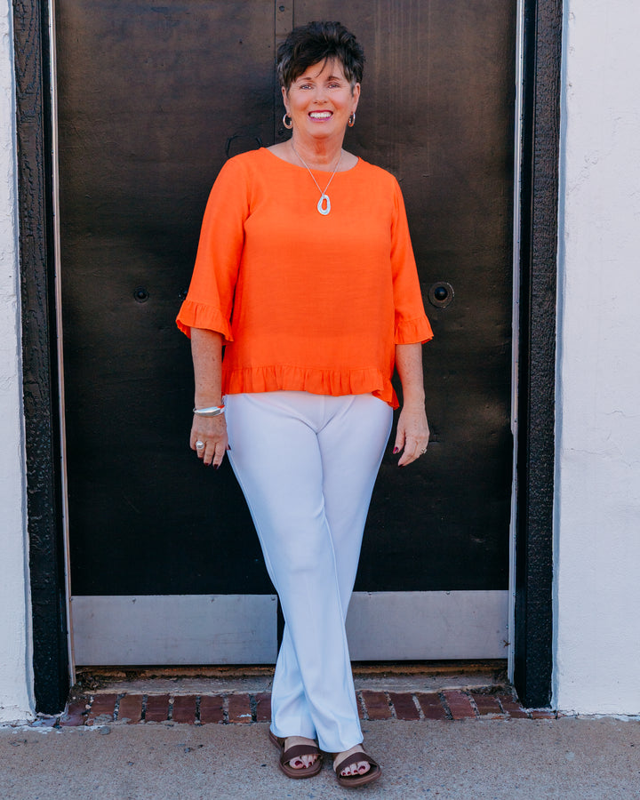 Multiples: Elbow Sleeve Scoop Neck Ruffle Hi-Lo Button Bk Top in International Orange (M26511TM) - The Vogue Boutique