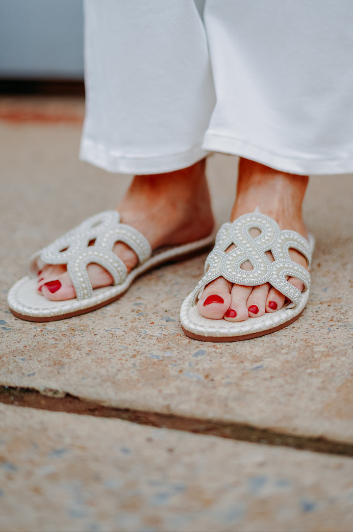 Jessica Simpson: Bria Flat Sandals in Soft Ivory