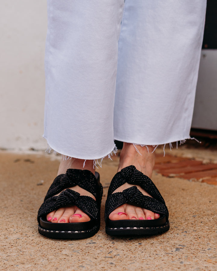 Jessica Simpson: Caralyna Flat Sandal in Black Shimmer - The Vogue Boutique