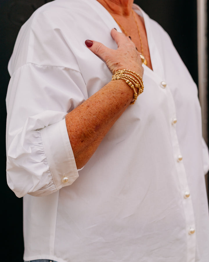 Karen Kane: Pearl Button Top in Off White (1L48200)