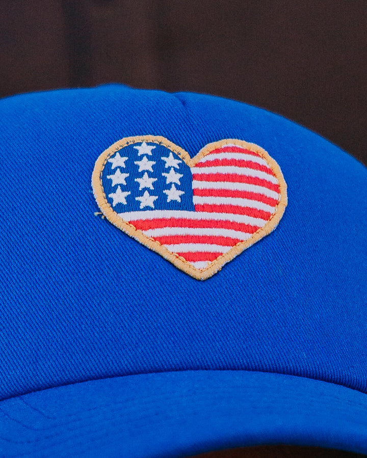 Z Supply: Heart Flag Trucker Hat in True Navy