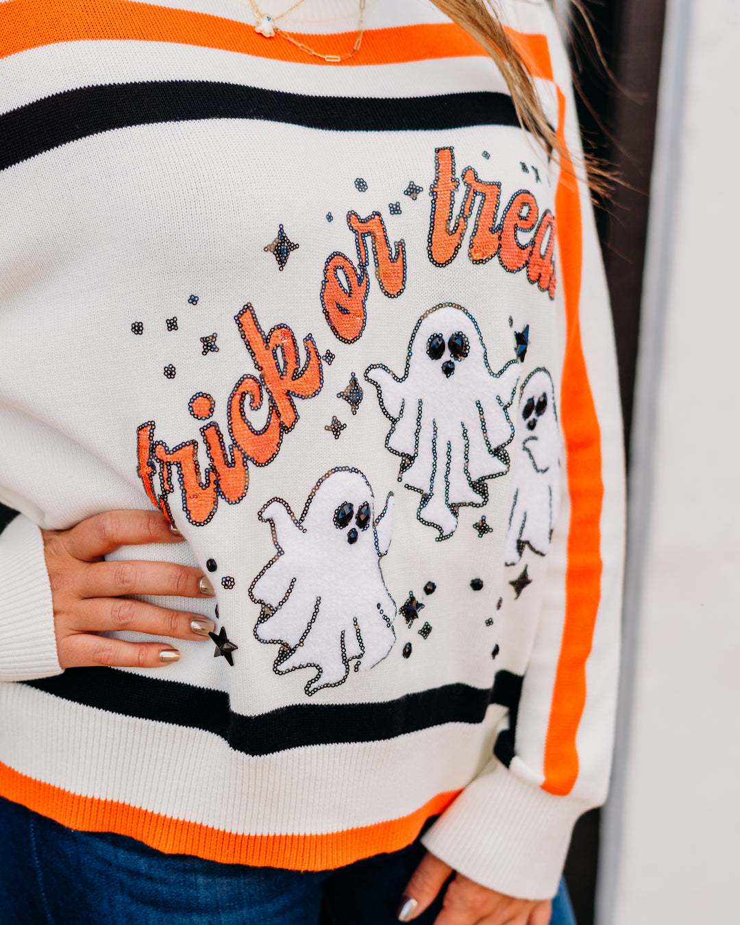Queen of Sparkles: 'Trick or Treat' Long Sleeve Sweater in White, Black, & Orange Stripe.