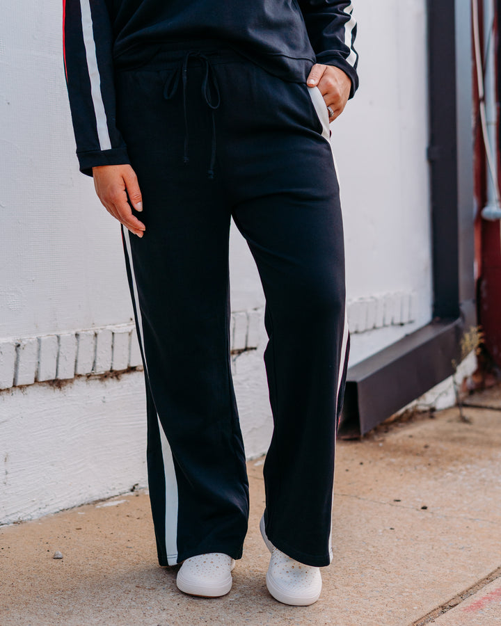 Jodifil: Track Pant in Black, Red, and Black