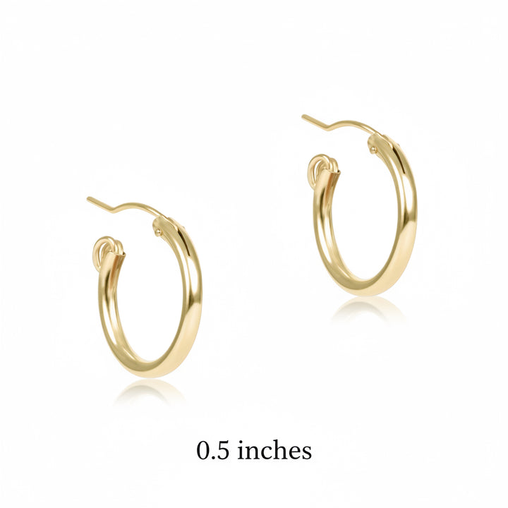 Enewton gold hoop earrings with post backs on white background