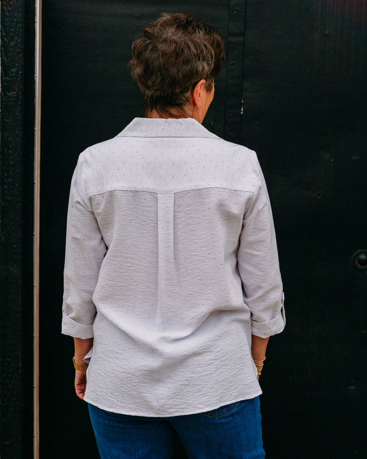 Multiples: Crunch Tab 3/4 Sleeve 2-Pocket Button Front High-Low Shirt in White - The Vogue Boutique