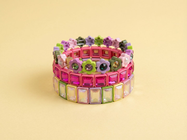 Three colorful enamel stretch bracelets with rectangular gems stacked together