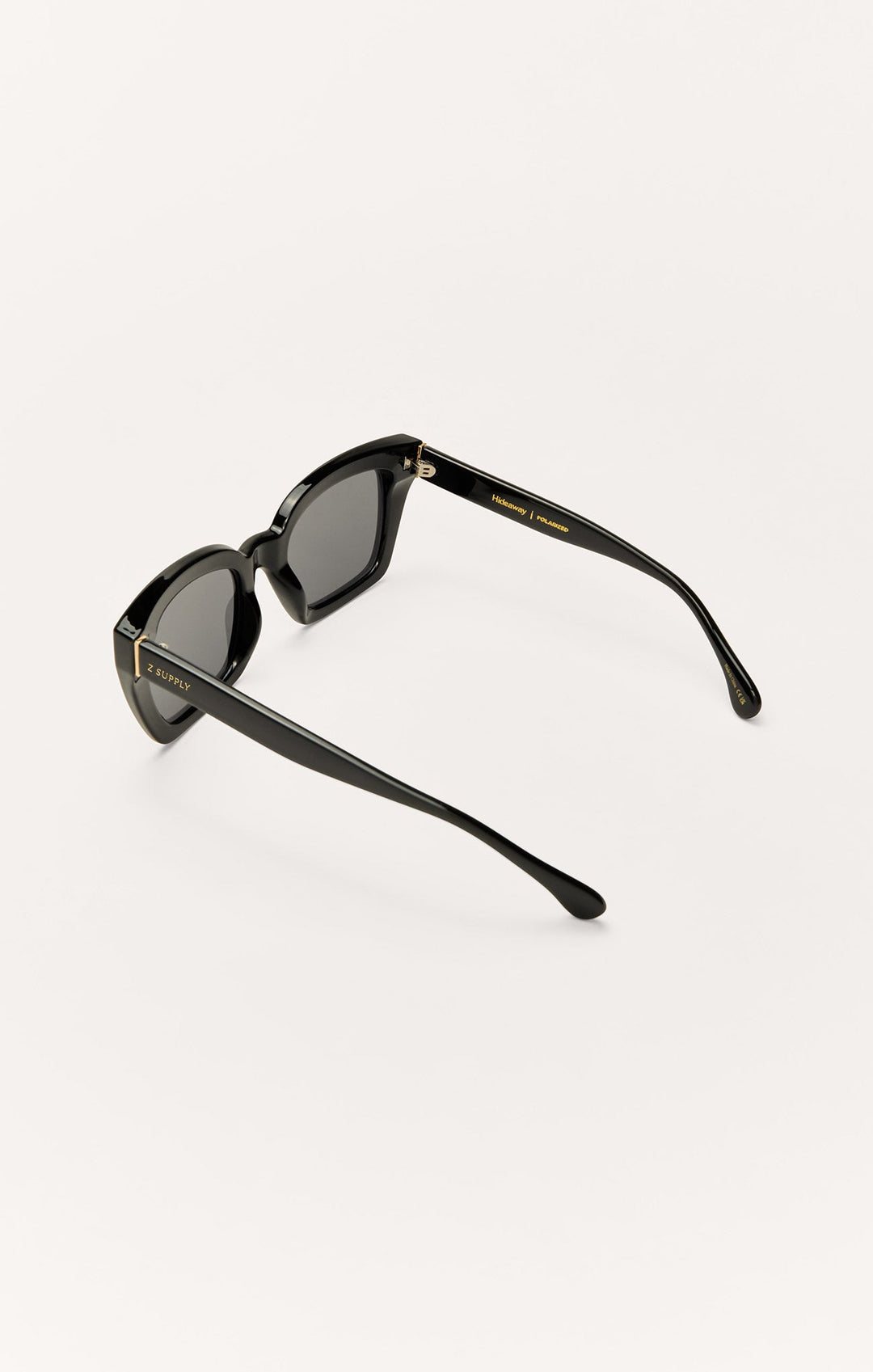 Z Supply Hideaway polarized sunglasses in polished black with grey lenses, side view