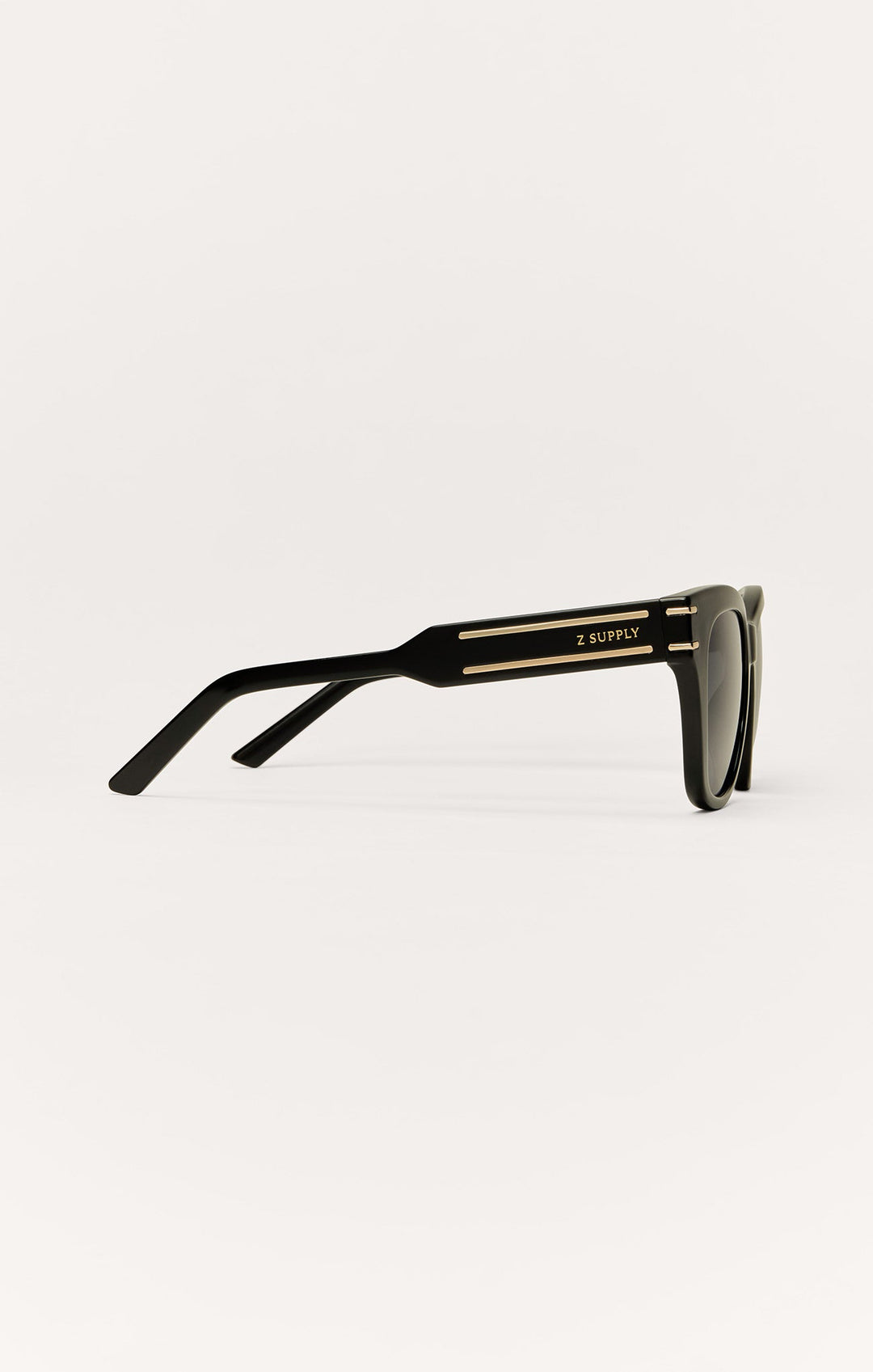 Z Supply Front Row sunglasses in polished black with gold detail accents, side view
