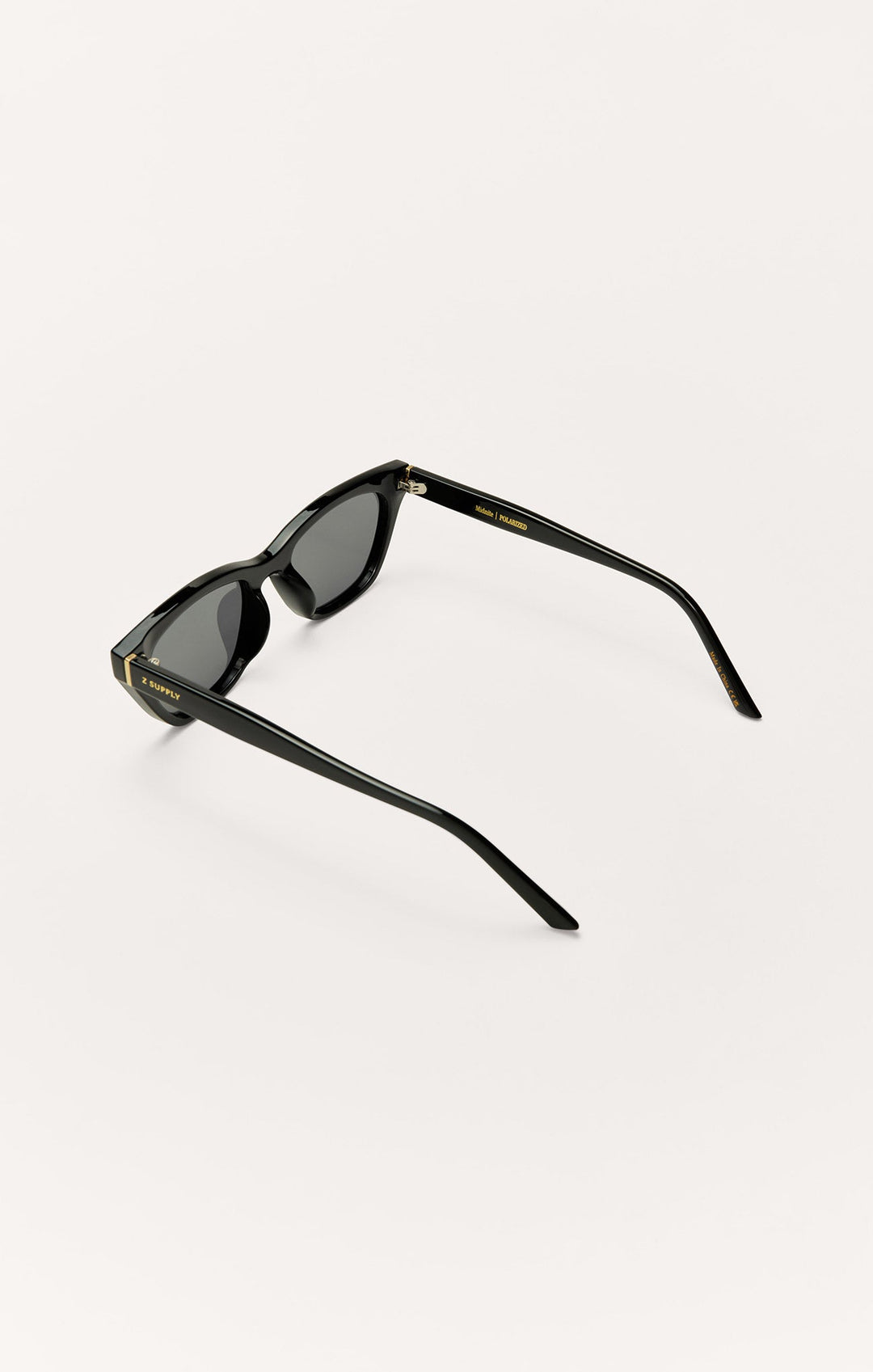 Z Supply Midnite polarized sunglasses in polished black with grey lenses, rear angle view