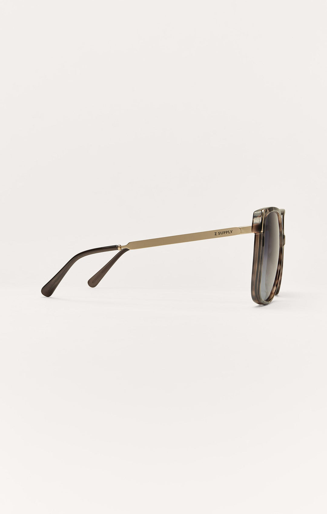 Z Supply Riviera sunglasses side view showing gold metal temple and brown tortoise frame