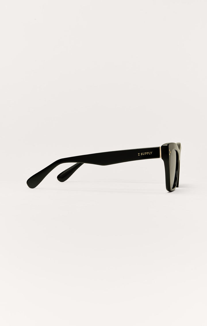 Z Supply Park Ave sunglasses in polished black with gold hardware, side profile view