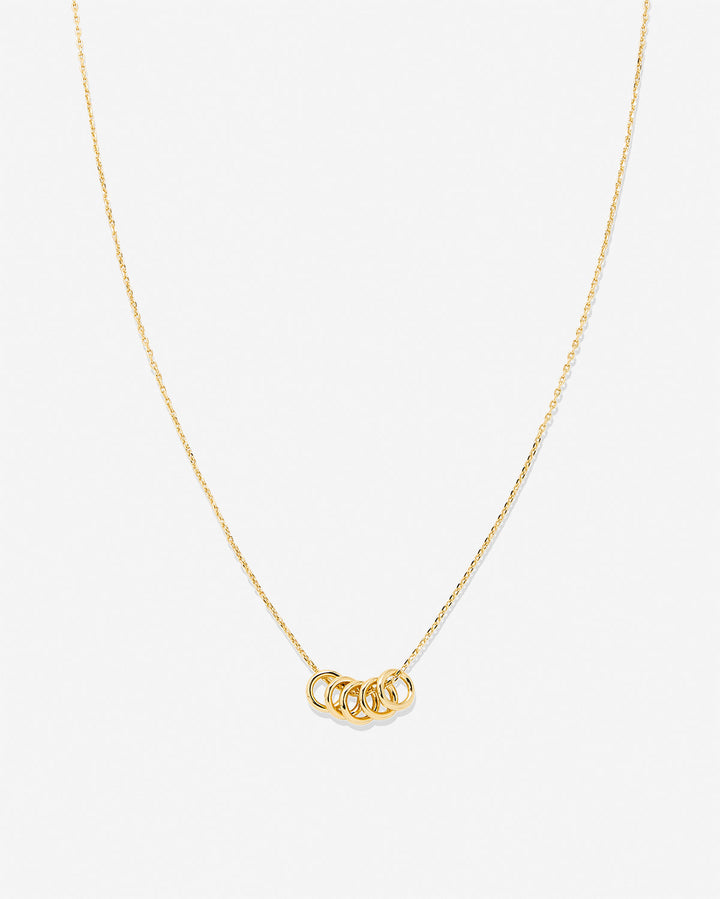 Gold dainty necklace with interconnected circle rings pendant on delicate chain