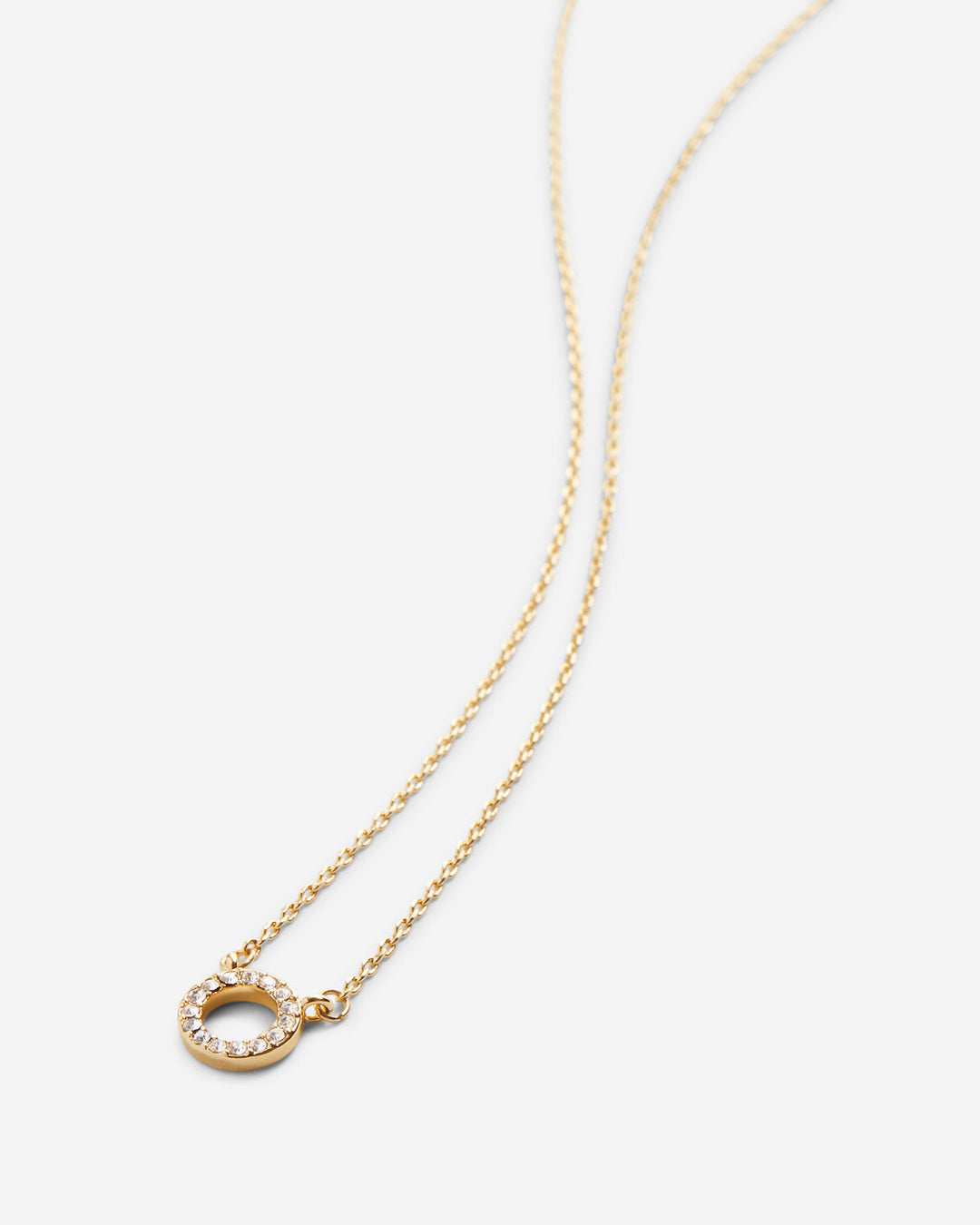 Gold circle pendant necklace with crystal pavé detailing on delicate chain