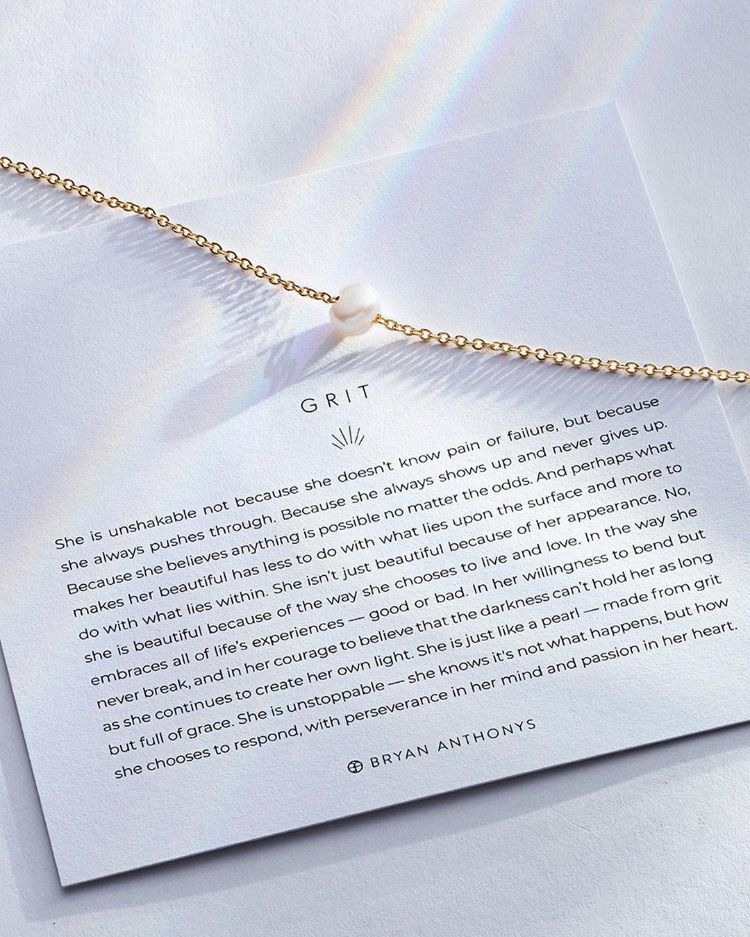 Bryan Anthonys Grit necklace in 14k gold with pearl pendant and inspirational card