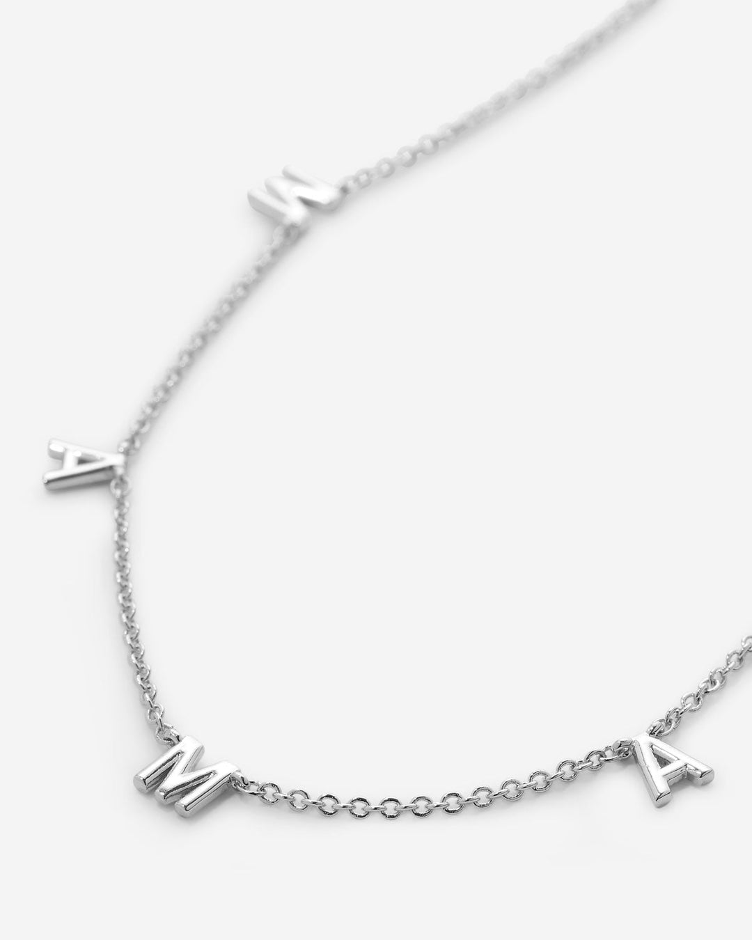 Silver chain necklace with individual letter charms spelling MAMA