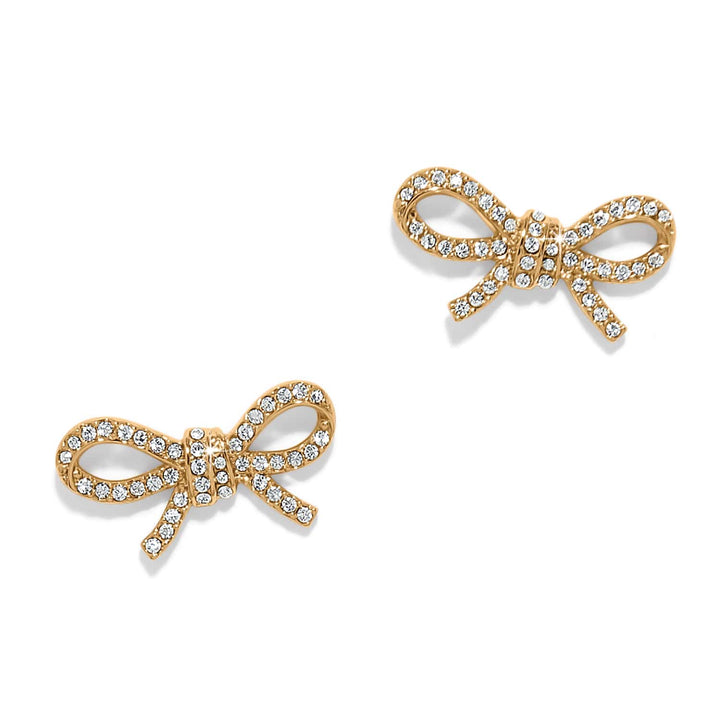 Gold bow-shaped post earrings adorned with clear crystals on white background