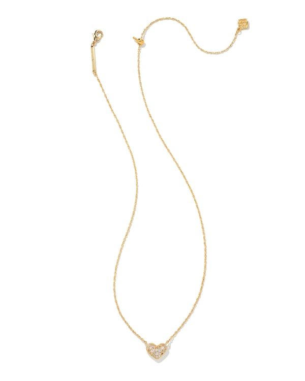 Kendra Scott Ari gold necklace with pave crystal heart pendant on white background