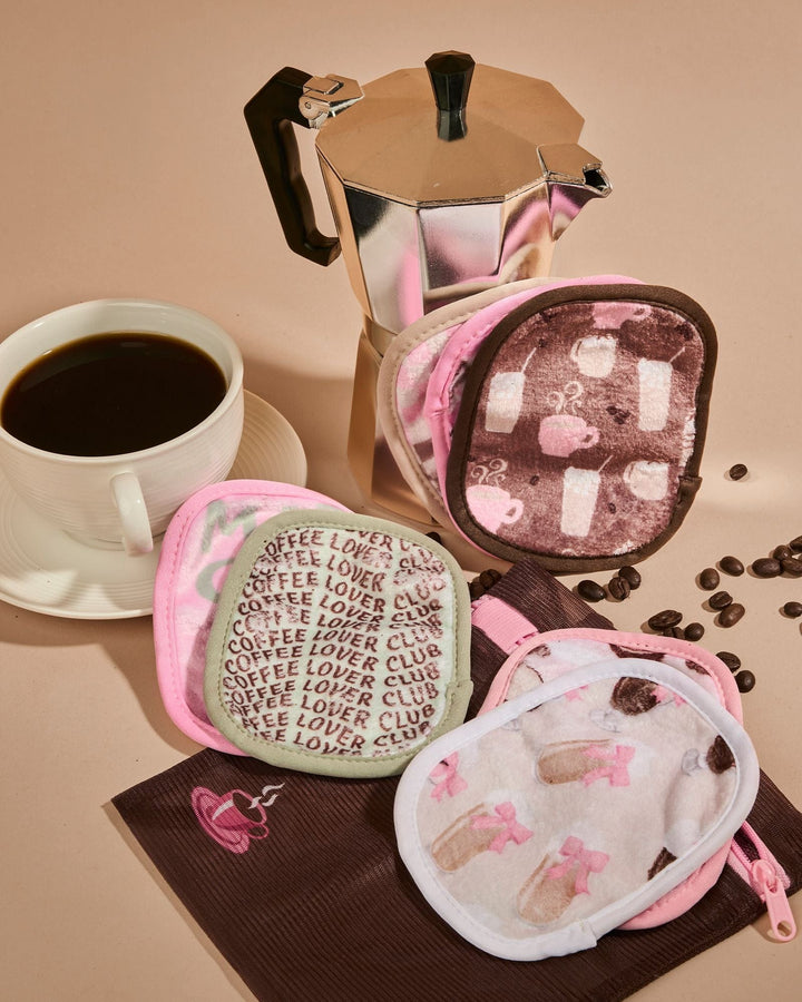 Coffee Break 7-Day makeup eraser set with pink pouches featuring coffee-themed patterns